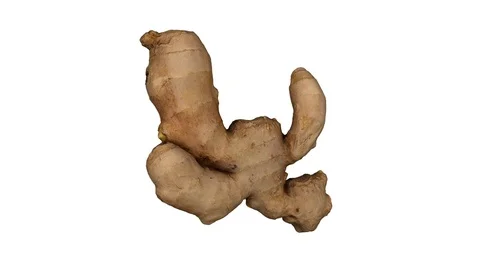 Rotating Fresh Ginger on White Background (Looping) Stockbeeldmateriaal 97742513