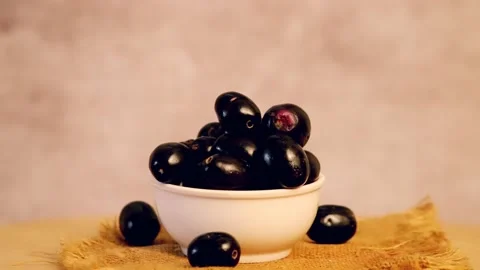 Rotating fresh jamun fruit on the dark background,turning indian blueberries  Stock Footage 197597127