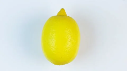 Rotating fresh lemon on a white background Видео 146277042