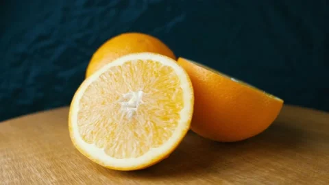 Rotating fresh sliced Orange fruit. Stock Footage 169289566