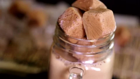 Rotating frozen milk tea drinks and milk tea ice cubes2 Stock Footage 236550163