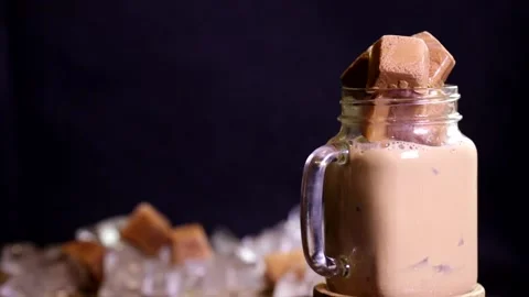 Rotating frozen milk tea drinks and milk tea ice cubes Stock Footage 236550164