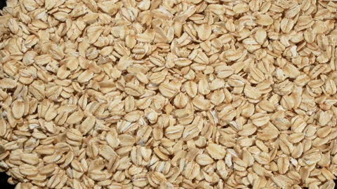 Rotating Full Frame Rolled Oats Texture - Top Down View. Video stock 333045523