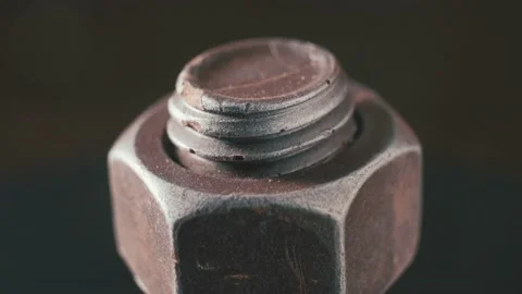 Rotating galvanized metal screw with nut close up Stock Footage 165992002