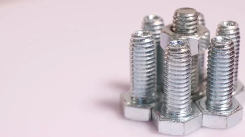 Rotating galvanized metallic screws close-up isolated on white background. Stock Footage 140616256