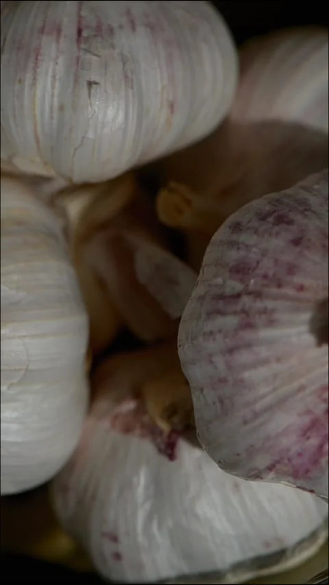 Rotating Garlic Bulbs, Macro Close Up Stock Footage 329235636
