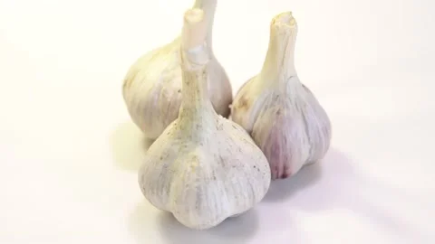 Rotating garlic head on wite background. Stock Footage 165475145