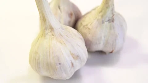 Rotating garlic head on wite background. Stock Footage 165475150