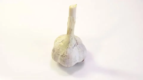 Rotating garlic head on wite background. Stock Footage 165475206