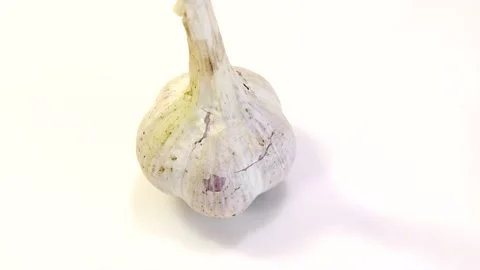 Rotating garlic head on wite background. Stock Footage 165475216