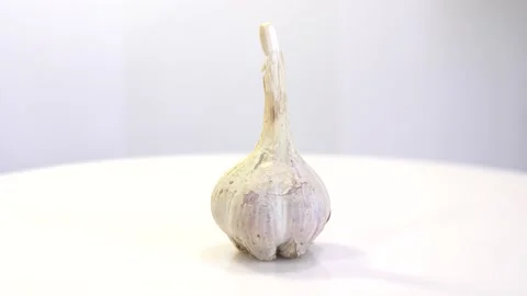 Rotating garlic head on wite background. Stock Footage 165475234