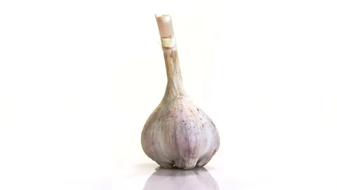 Rotating garlic head on wite background. Stock Footage 165475371
