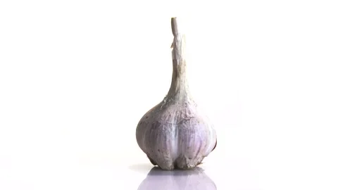 Rotating garlic head on wite background. Stock Footage 165475484