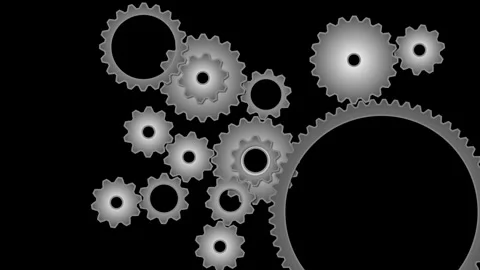 Rotating gears and interlocking cogwheels turning in synchronization on black Stock Footage 321687532