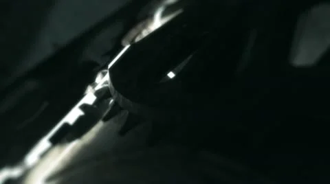Rotating gears with light beam Stock Footage 12293987