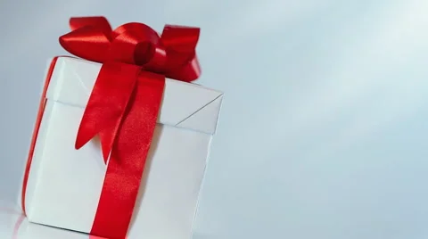 Rotating gift in white box with red ribbon 스톡 동영상 1069516