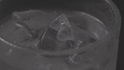 Rotating Glas with Ice, Black Background, Clog3, Cinema Gamut Stock Footage 241814114
