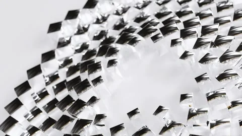 Rotating glass cubes moving in a continuous circle over a bright white surface Stock Footage 344148431
