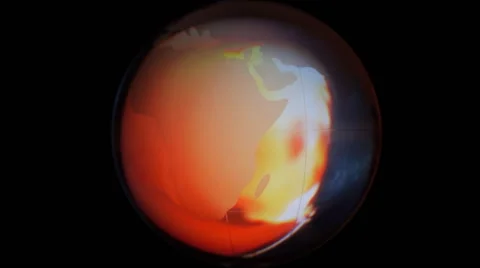 The rotating glass globe on the background of  the fire  Video stock 49672329