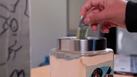 Rotating glass jar captures reflection in room with modern art accents Stock Footage 308810971