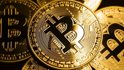 Rotating gold bitcoin in slow motion. Stock Footage
