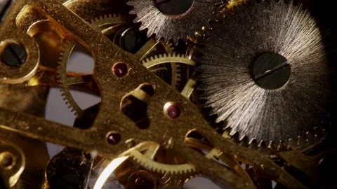 Rotating golden gears work within a complex watch mechanism Stock Footage 329595874