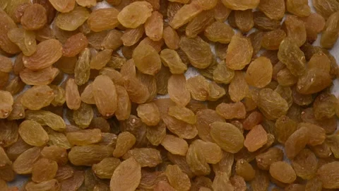 Rotating Golden Raisins Background Top View Healthy Dried Grapes Macro 4K Video Stock Footage 340753230