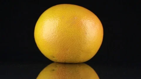 Rotating grapefruit and its reflection o... | Stock Video | Pond5