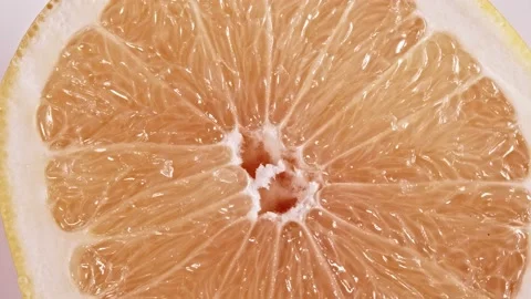 Rotating  grapefruit Slice. Stock Footage 144448883