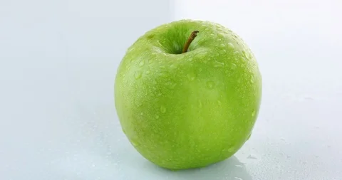 Rotating green apple isolated on white background	 Stock Footage