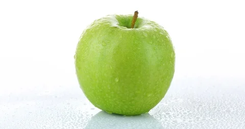Rotating green apple isolated on white background	 Stock Footage 102249132