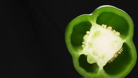 Rotating Green Bell Pepper Cross Section Macro Close Up Black Background Stock Footage 325565837