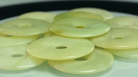 Rotating green jade donuts Video stock 46706311