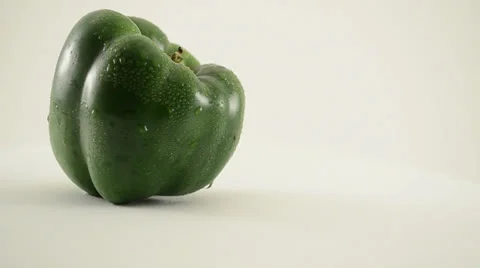 Rotating Green Pepper Against White - Crane Up Stock Footage 22648679