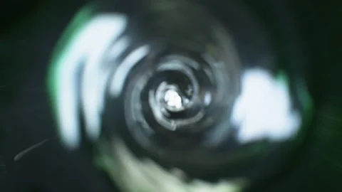 Rotating green water on black background Stock Footage 135355259