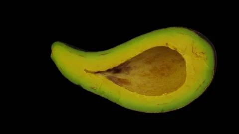 Rotating Half Long Neck Avocado on Black Background (Looping) Stock Footage 149277985