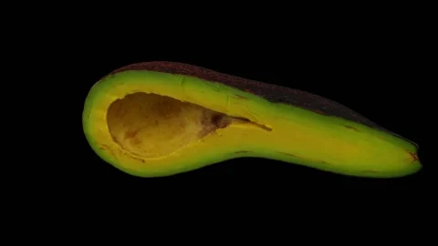 Rotating Half Long Neck Avocado on Black Background (Looping) Stock Footage 149278244