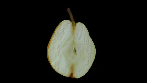 Rotating Half Pear on Black Background (Looping) Stock Footage 93378663