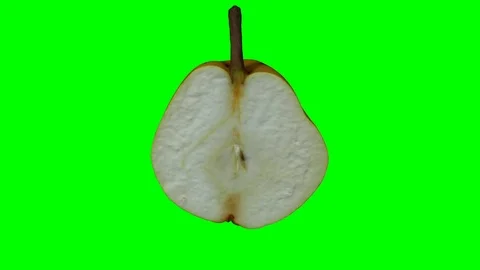 Rotating Half Pear on Green Background (Looping) Stock Footage 93378696