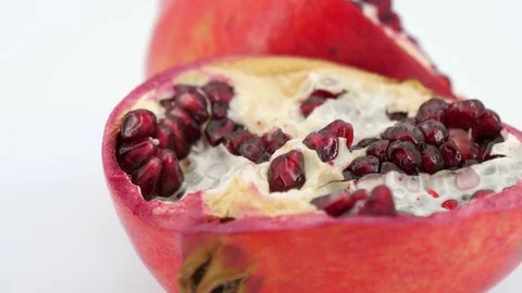 Rotating half pomegranate fruit isolated on white background. Stock Footage 83702240