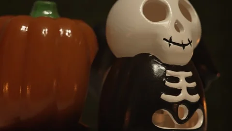 Rotating Halloween pumpkin, skeleton skull head and bat devil with scary grim Stock Footage 251042083