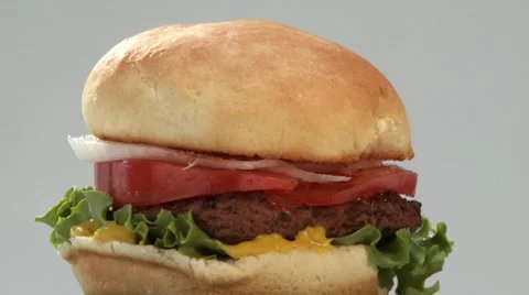 A rotating hamburger Stock Footage 8572356