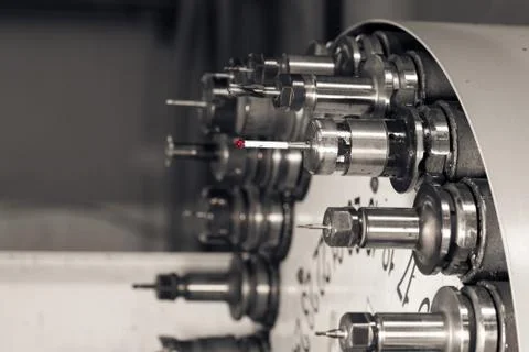 Rotating head with tools at CNC lathe in workshop Stock Photos