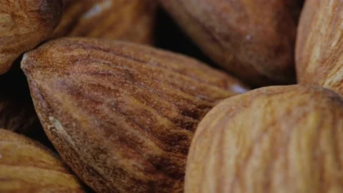 Rotating heap of almonds nuts. close up. selective focus. Stock Footage 218318046