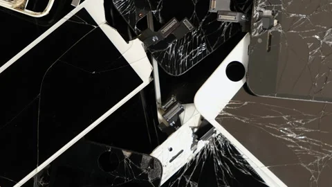 A rotating heap with the Apple iPhone broken screens lying one on top of another Stock Footage 235699454