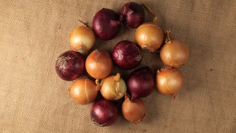 Rotating heap of red and yellow onions Stock Footage 343435463