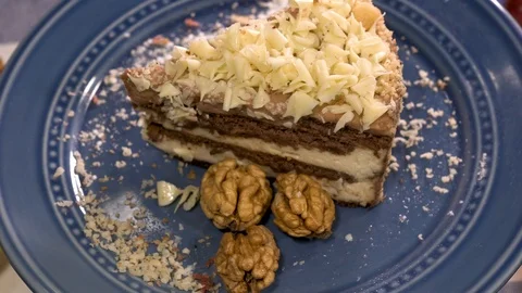 Rotating home-made cake decorated with walnuts Stock-Footage 88260244