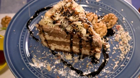 Rotating home-made cake decorated with walnuts Stock-Footage 88260517
