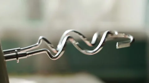 Rotating the hooks of the kitchen blender attachments close-up. How the kitchen Stock Footage 196107121