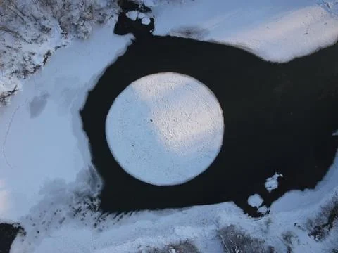Rotating ice disk on the river (ice carousel in Siberia) Stock Photos